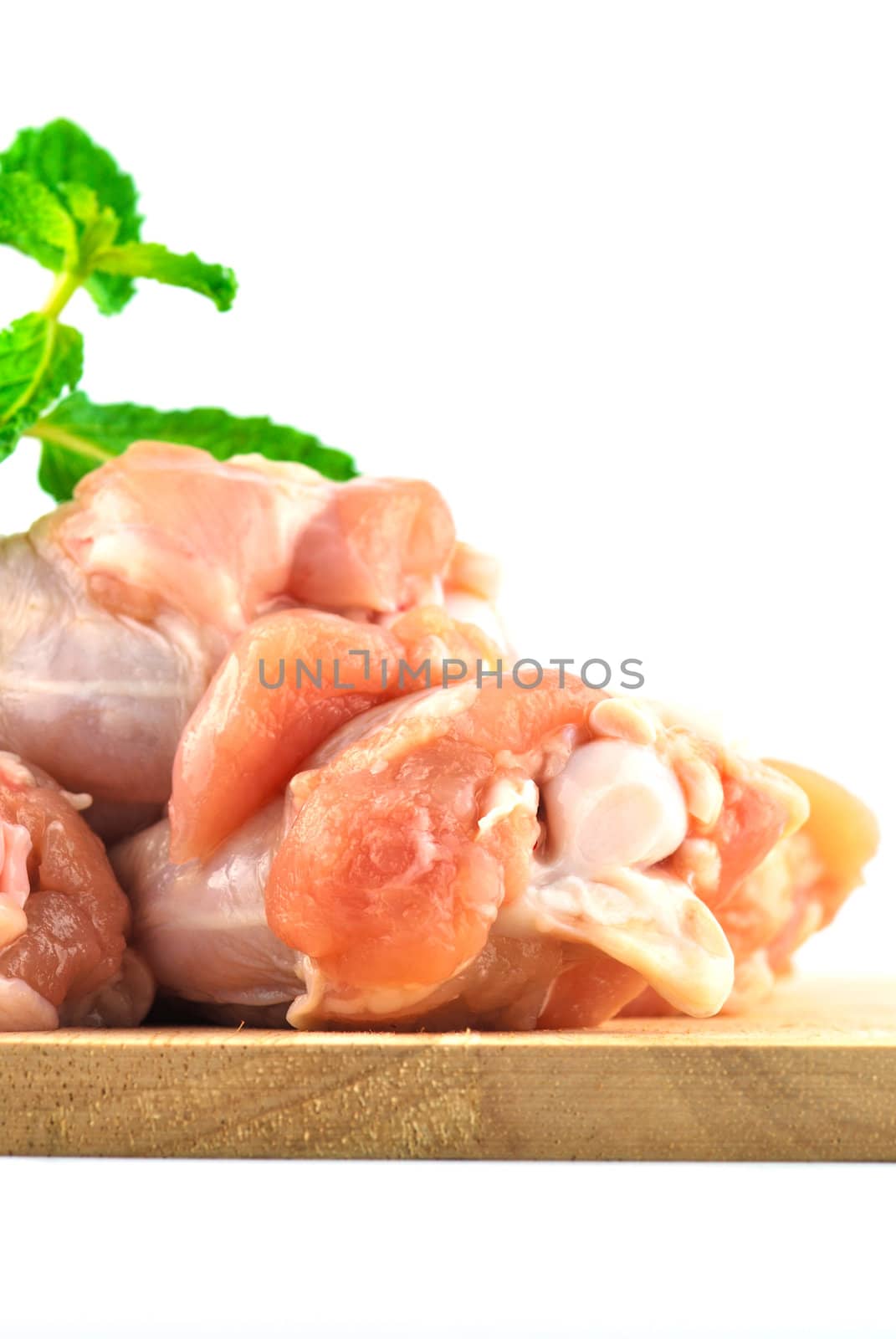 Chicken wing meat on chop board by teen00000