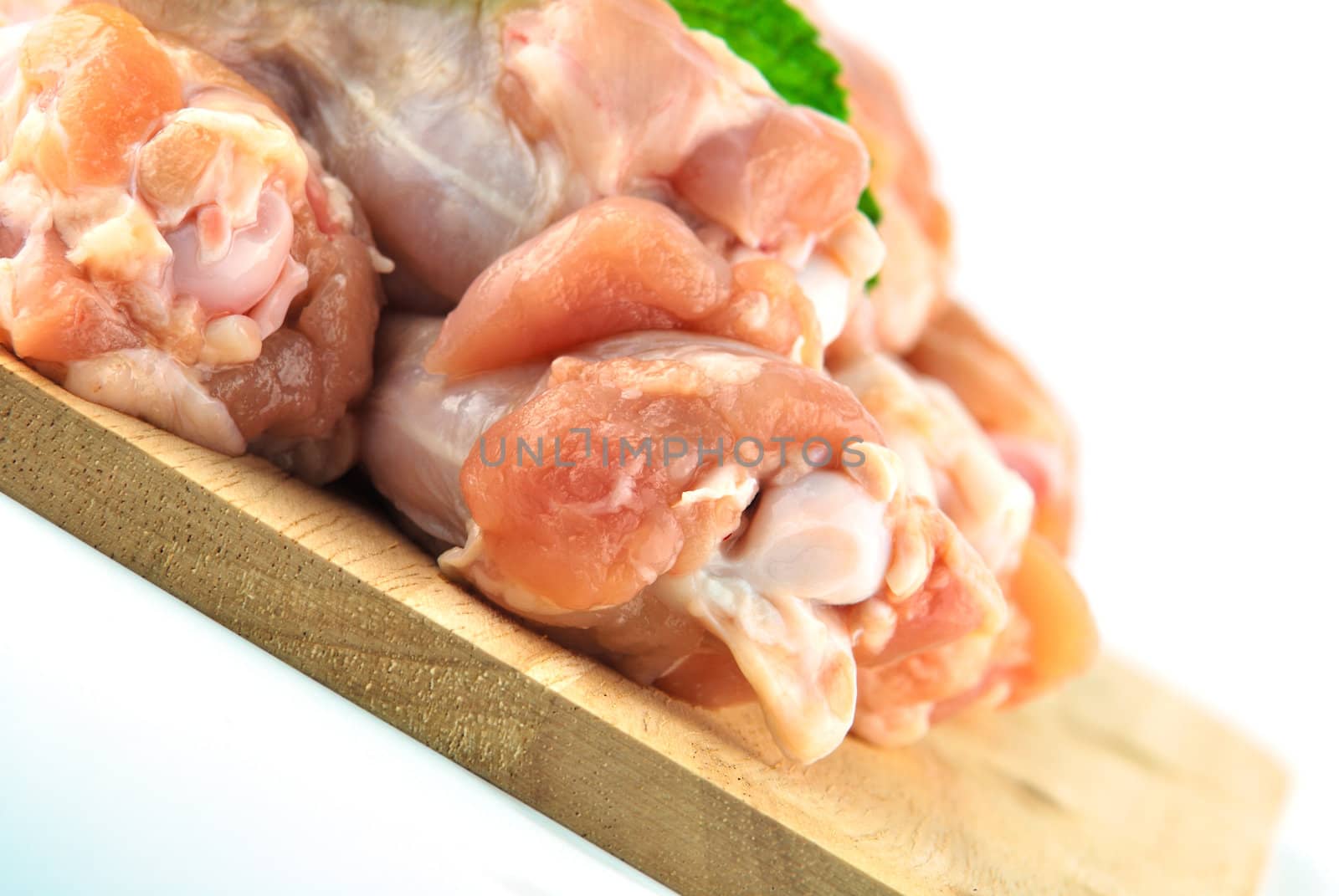 Chicken wing meat on chop board