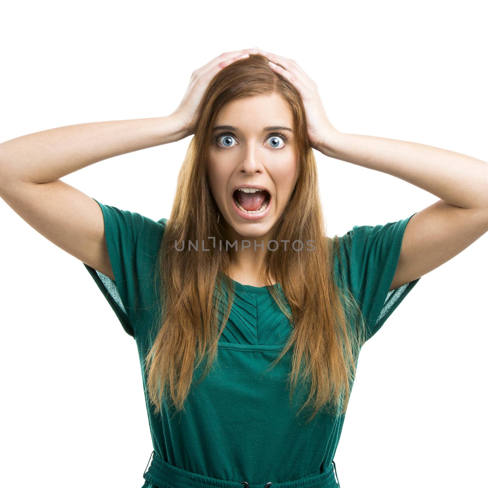 Portrait of a beautiful girl with a panic expression isolated on white background