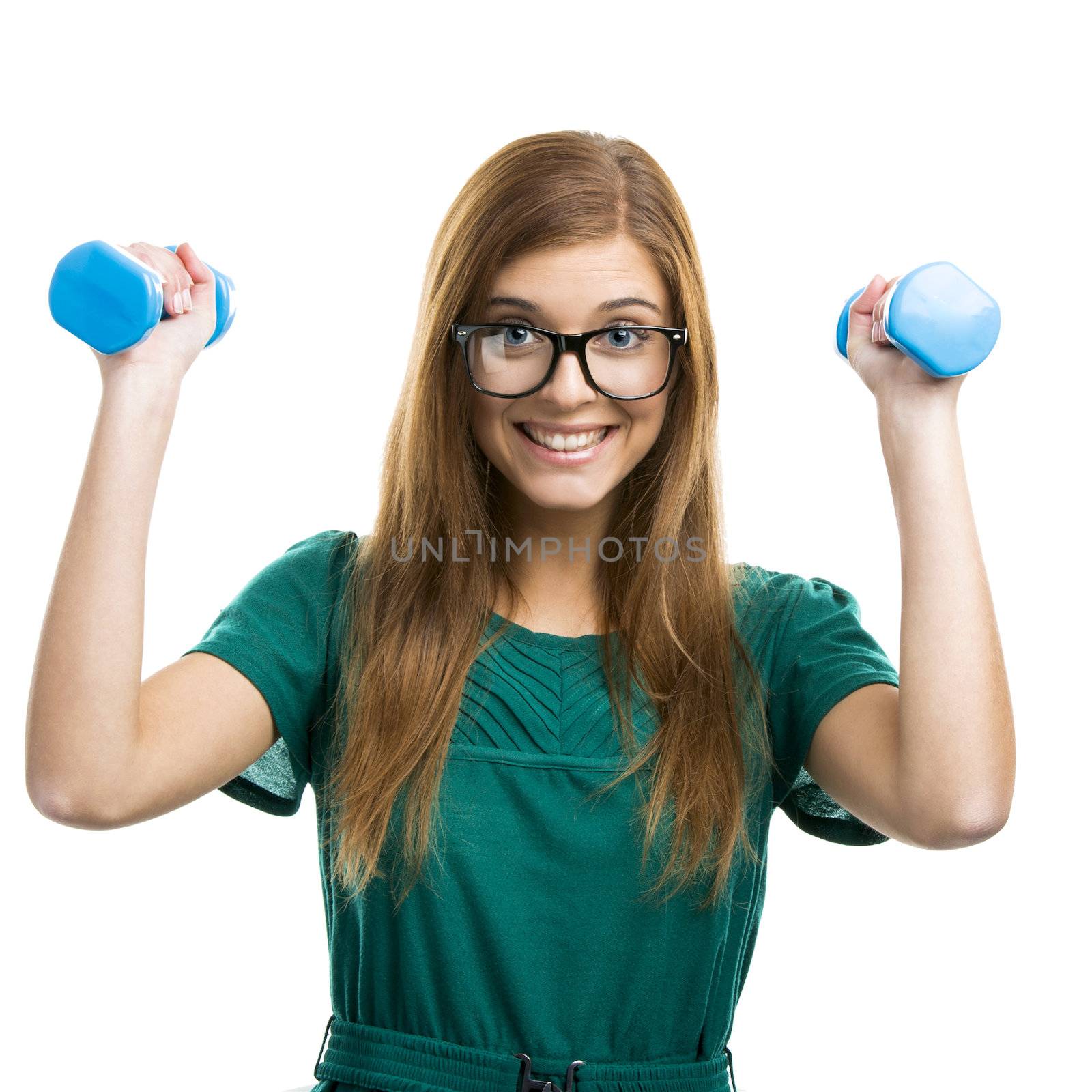 Portrait of a beautiful and happy girl making exercise isolated on white background