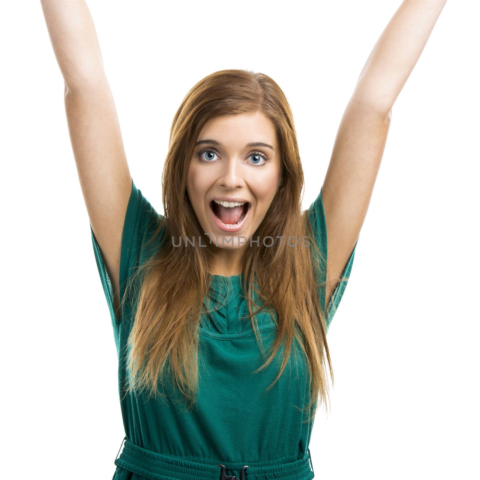Portrait of a happy beautiful young woman with arms up