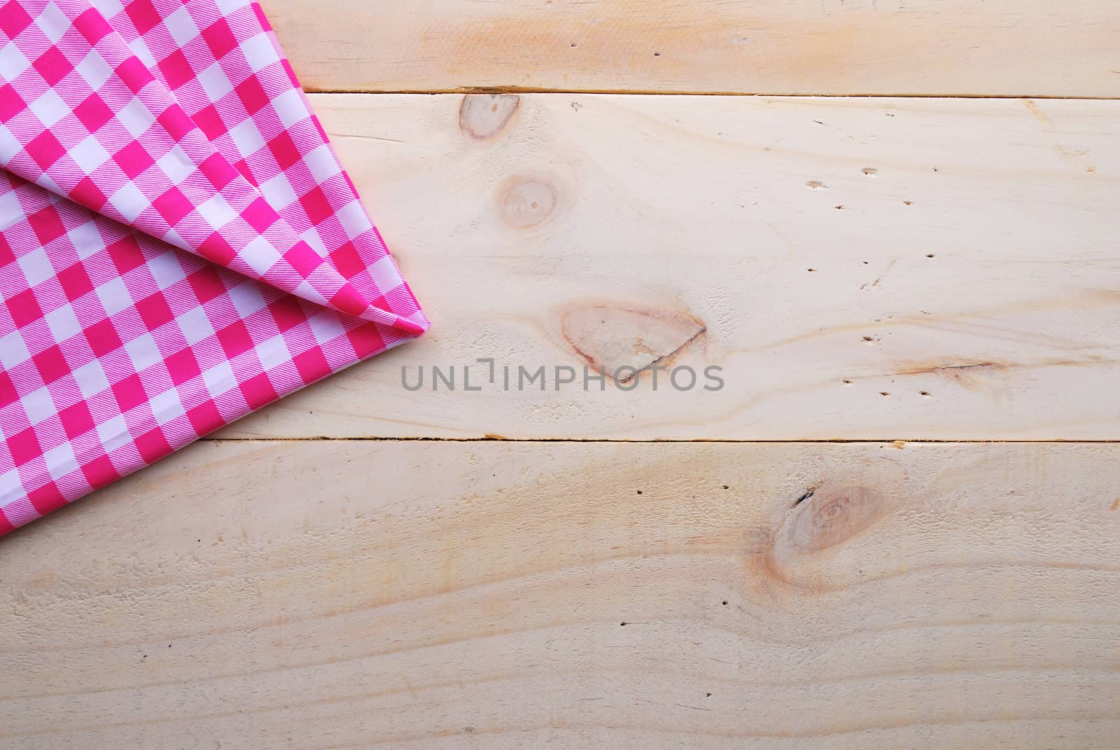 the background made from tablecloth on wooden table by teen00000