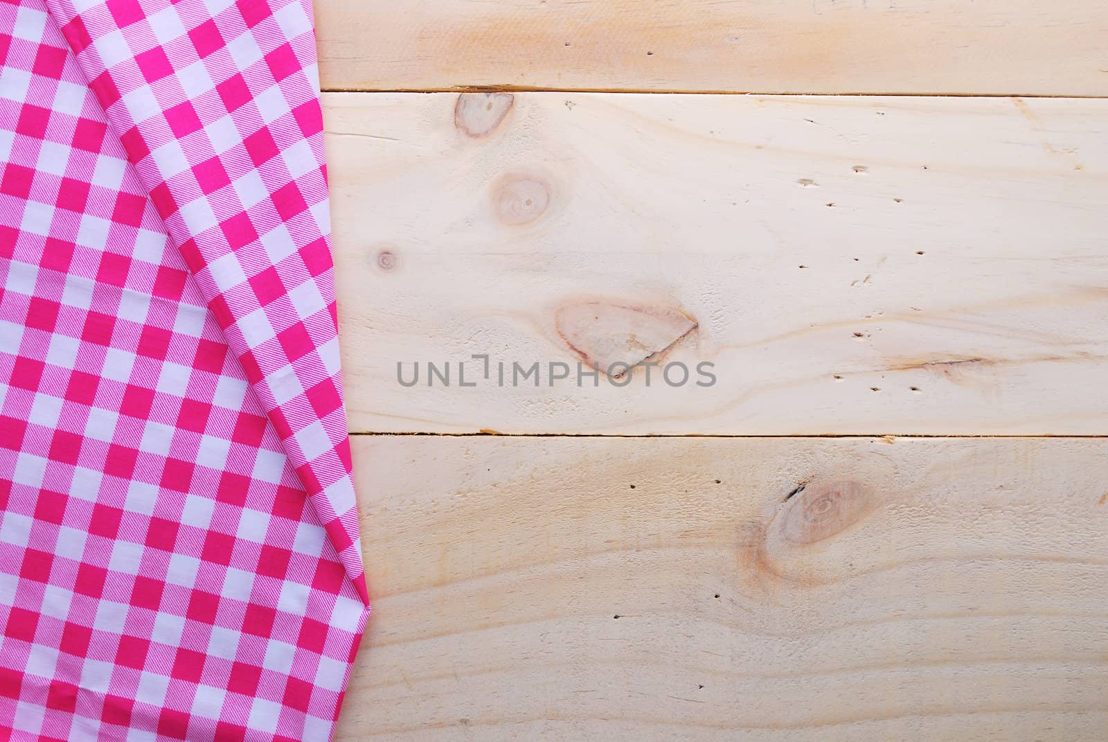 the background made from tablecloth on wooden table