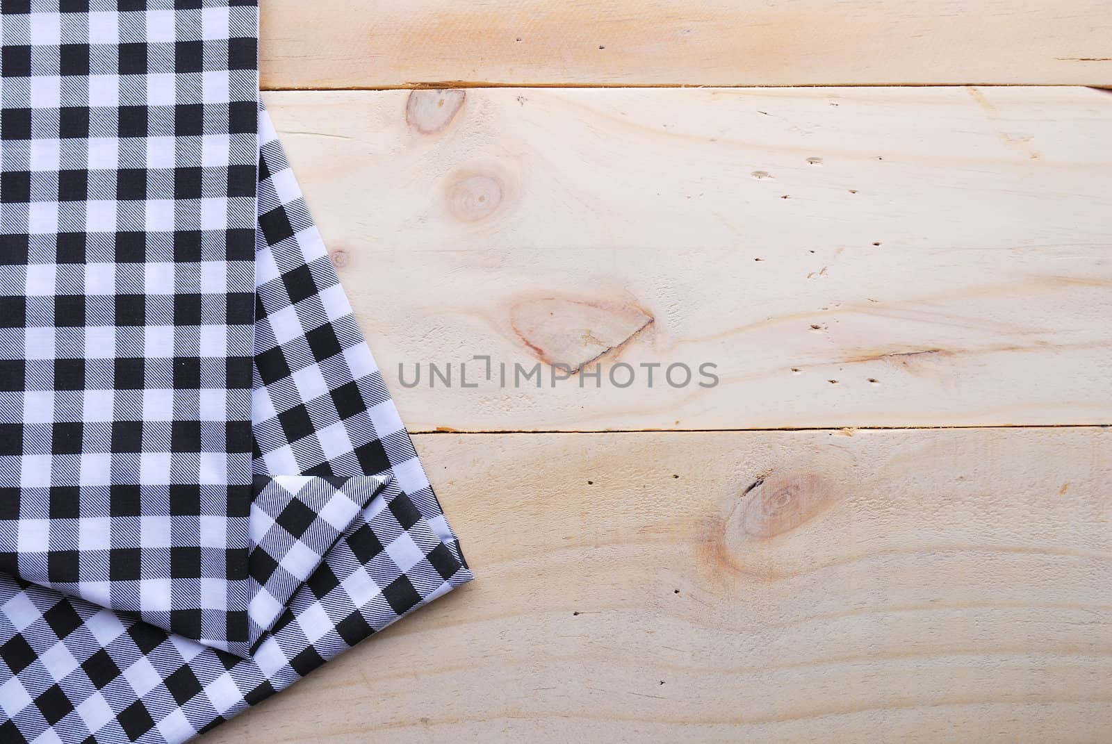 the background made from tablecloth on wooden table by teen00000
