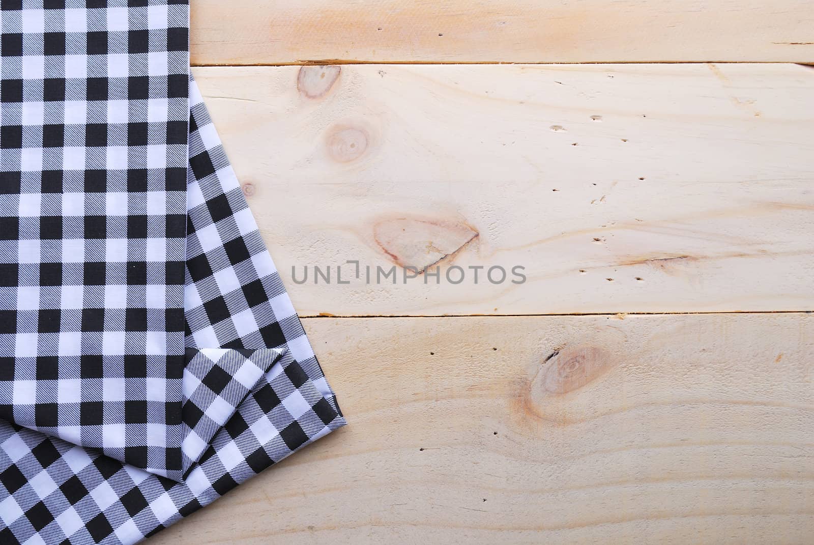 the background made from tablecloth on wooden table