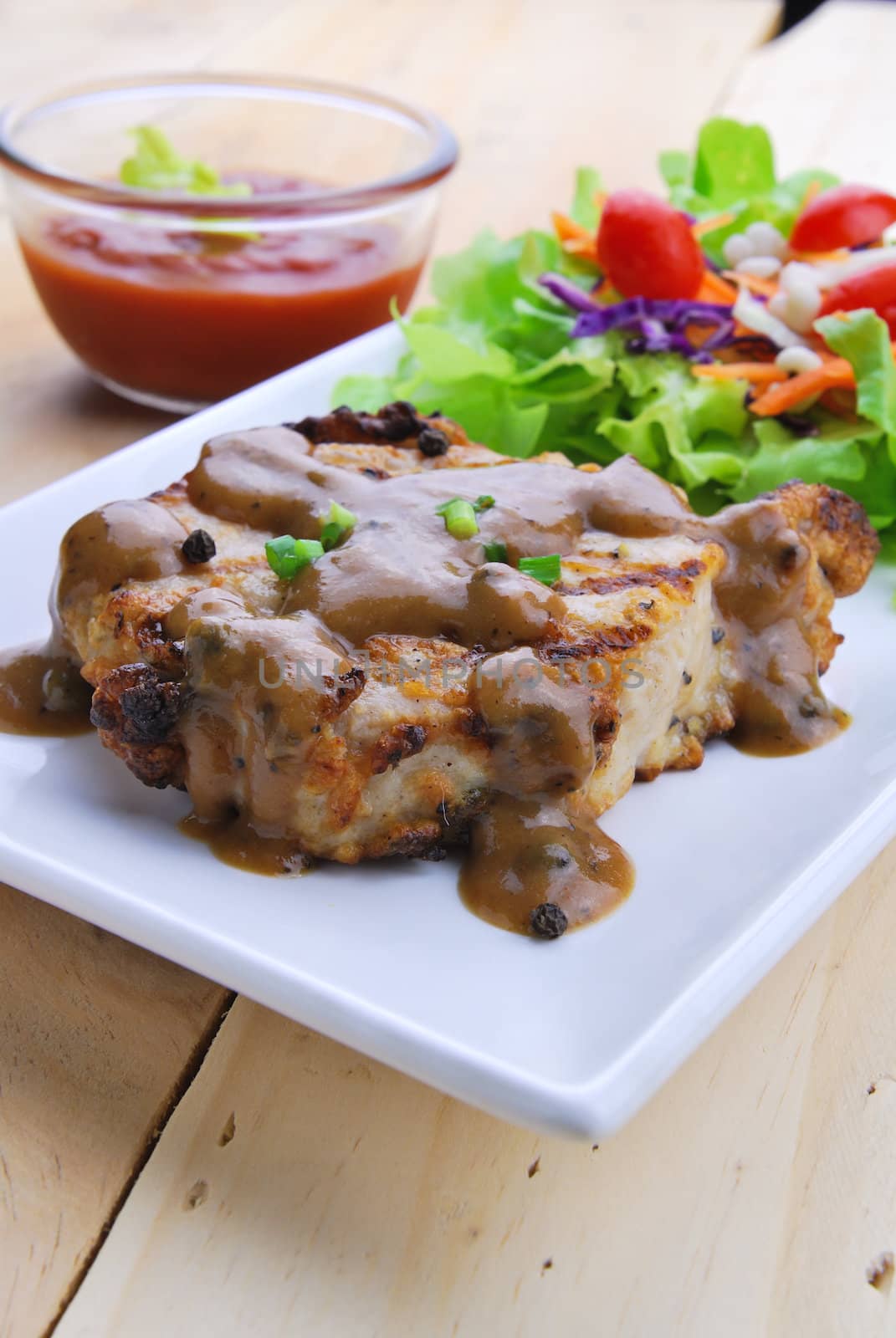 Grilled steaks, pork with pepper gravy and vegetable salad  by teen00000