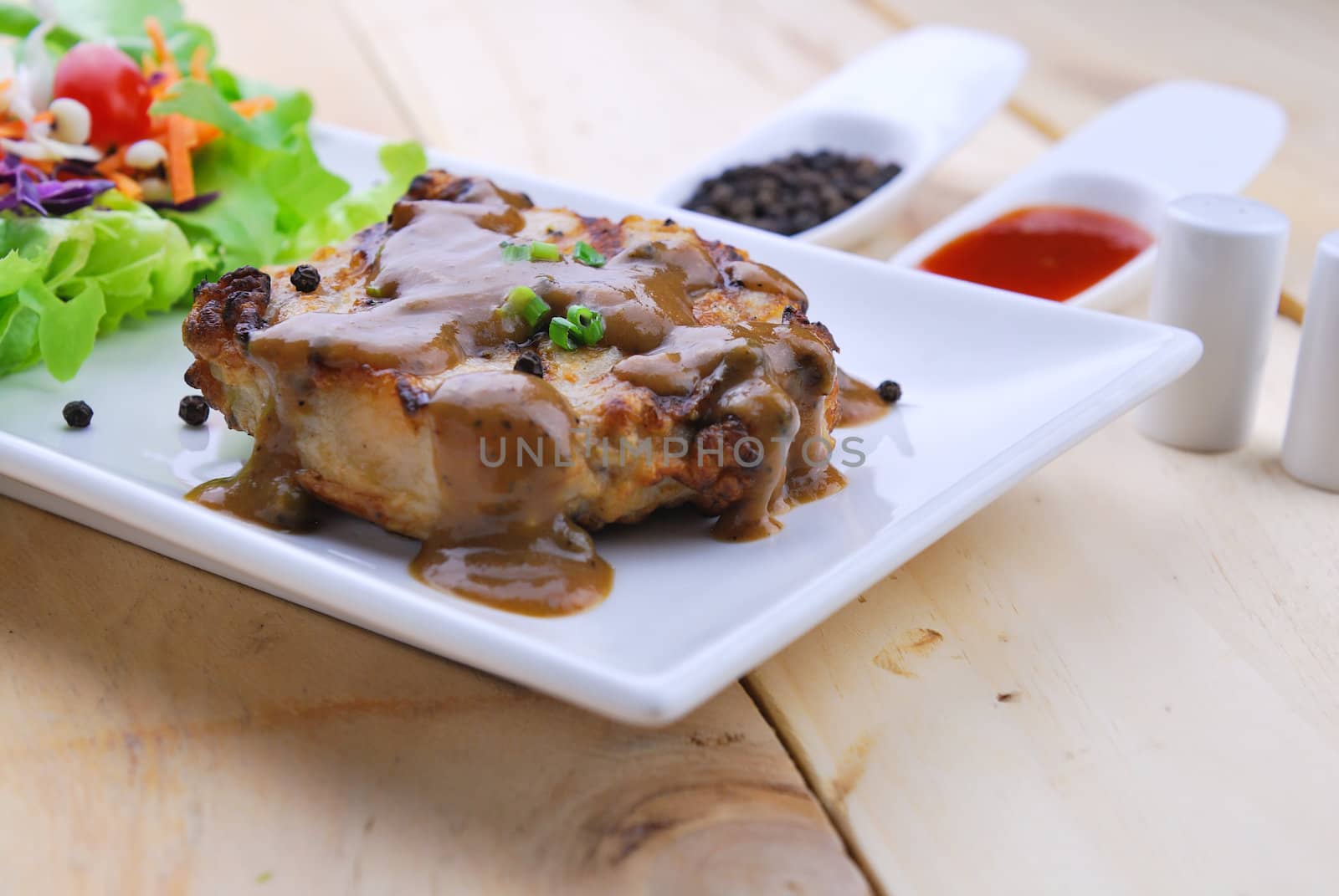 Grilled steaks, pork with pepper gravy and vegetable salad  by teen00000