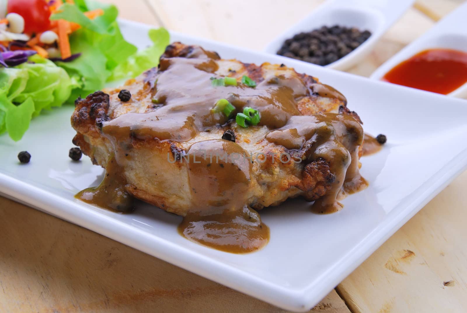 Grilled steaks, pork with pepper gravy and vegetable salad  by teen00000