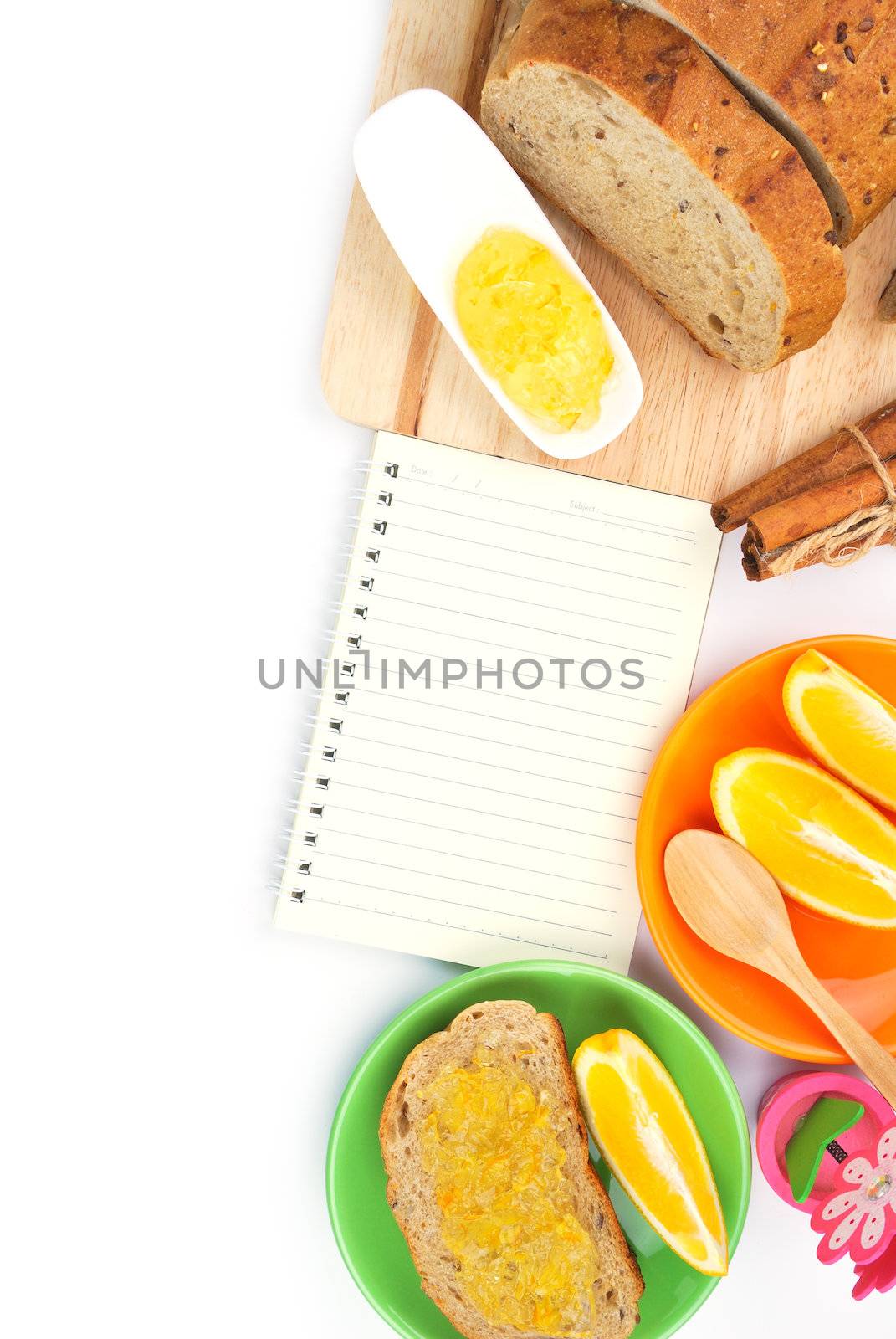 Recipe book with wholegrain bread and orange jam by teen00000