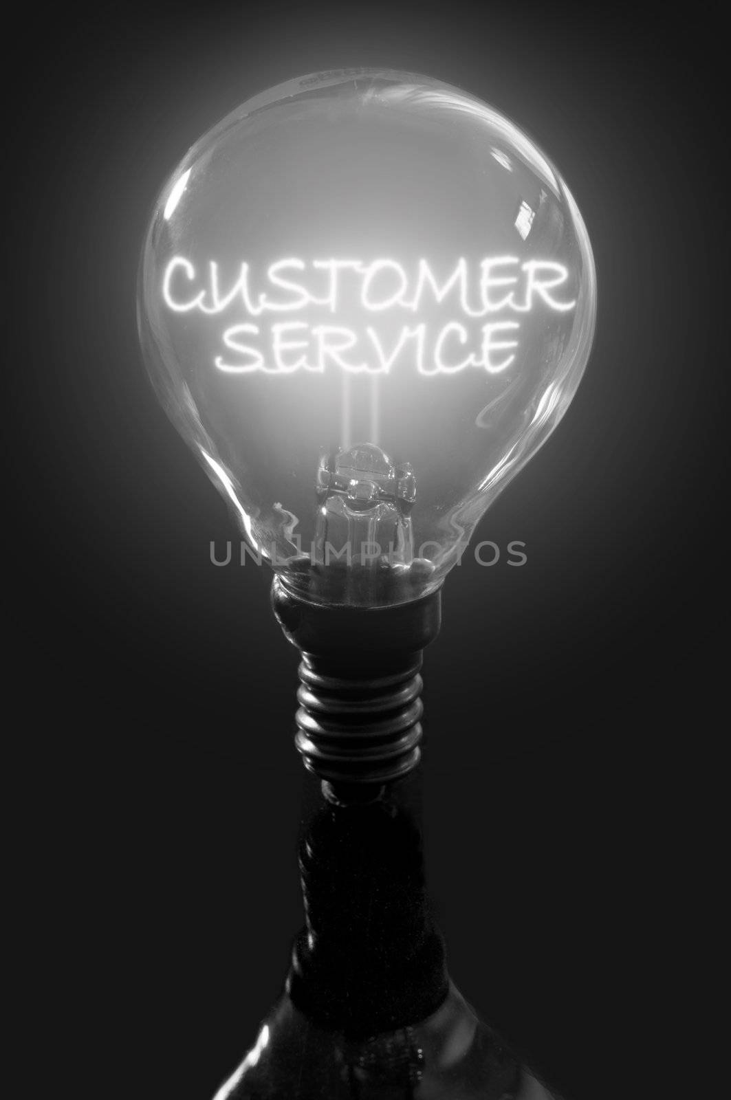 Illuminated customer service sign inside a light bulb