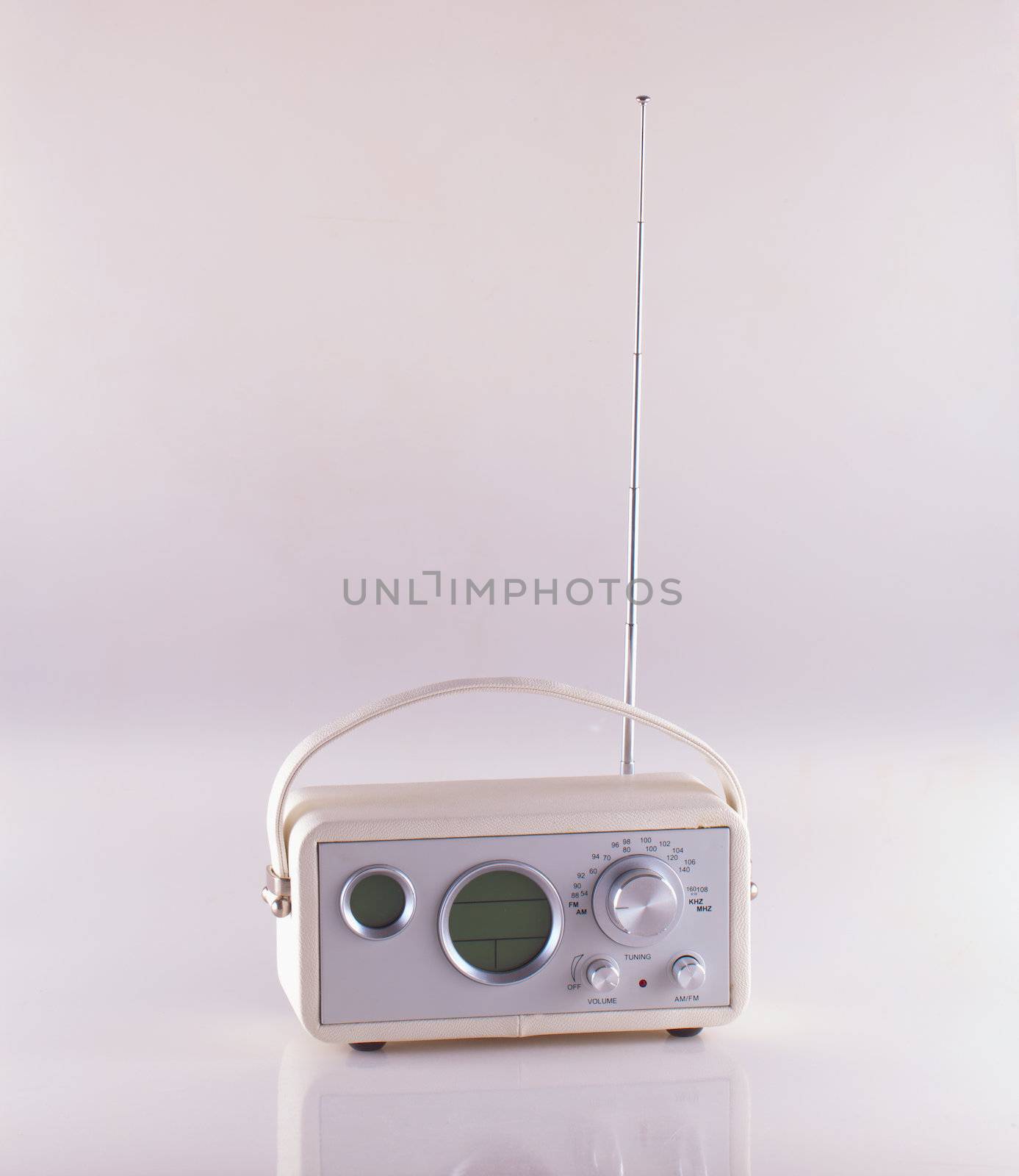 White vintage radio over white reflecting background