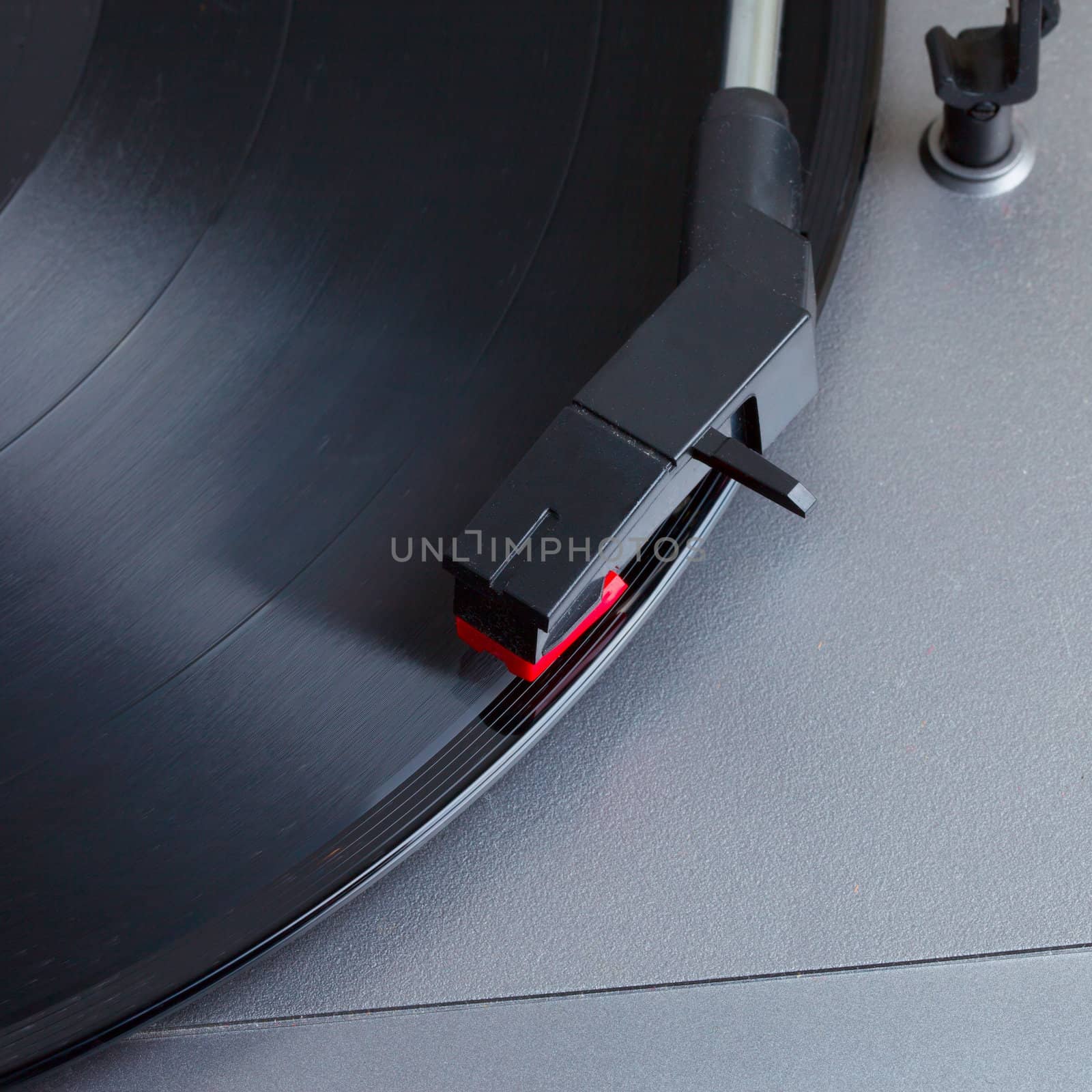 Turntable with a vinyl record, square image