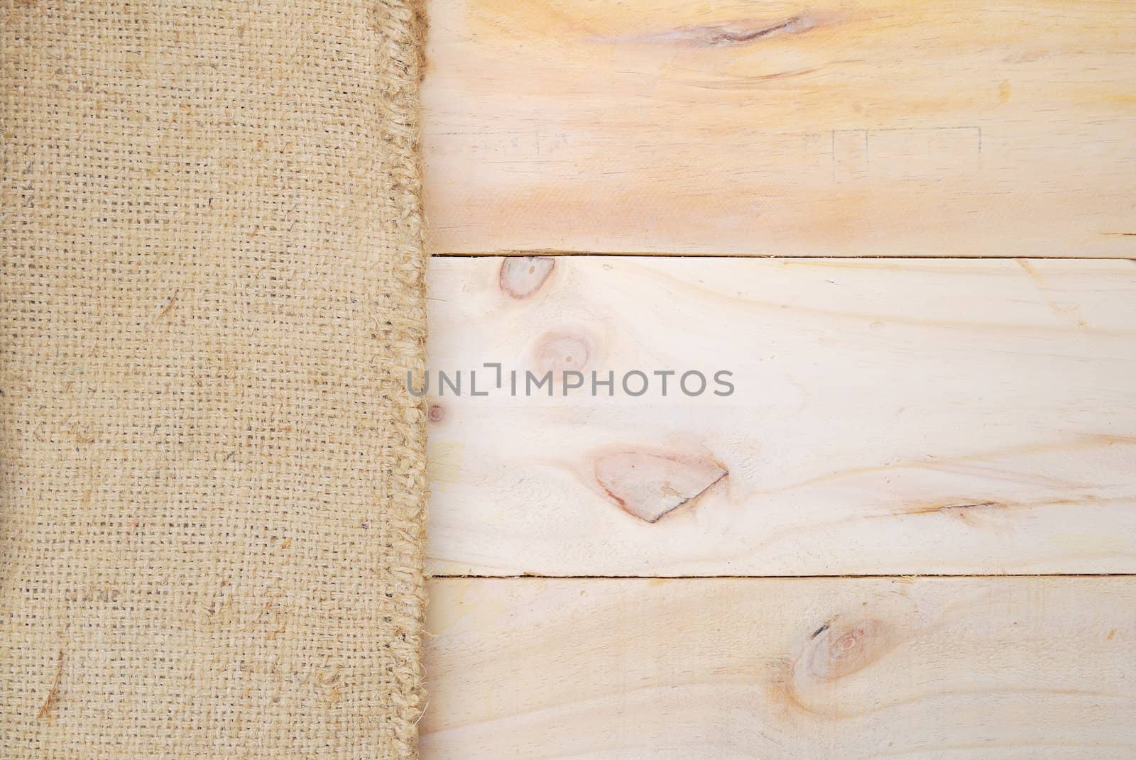 Gunny sack texture and wood plank table background