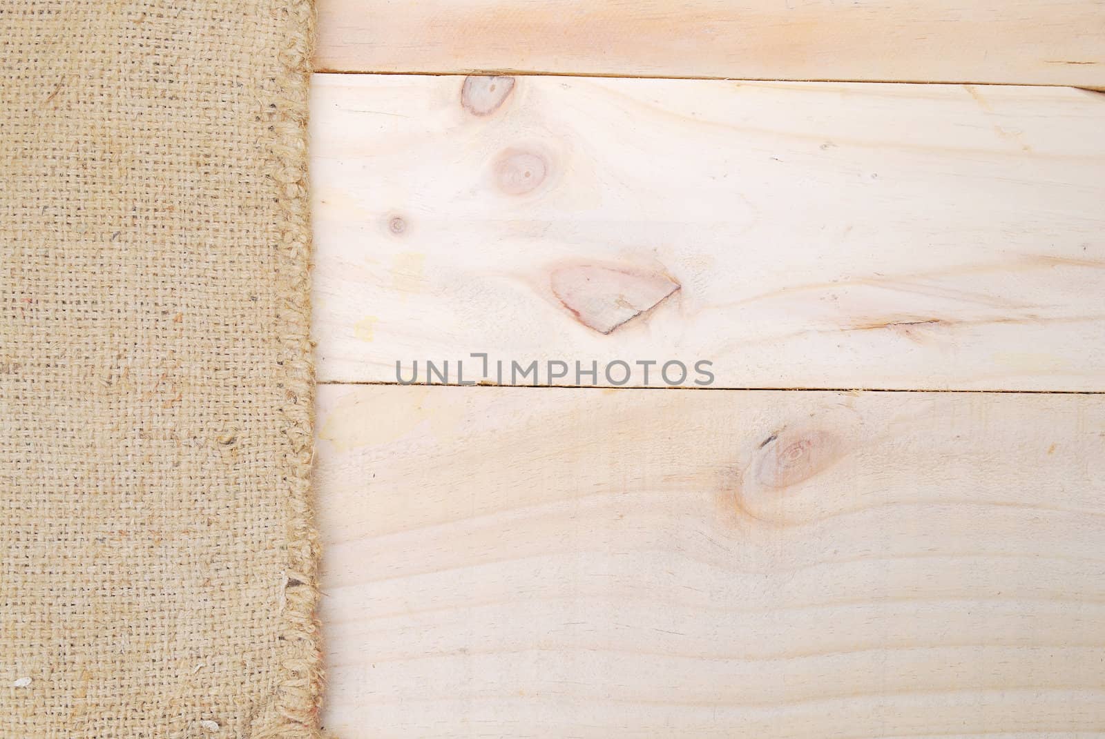 Gunny sack texture and wood plank table background