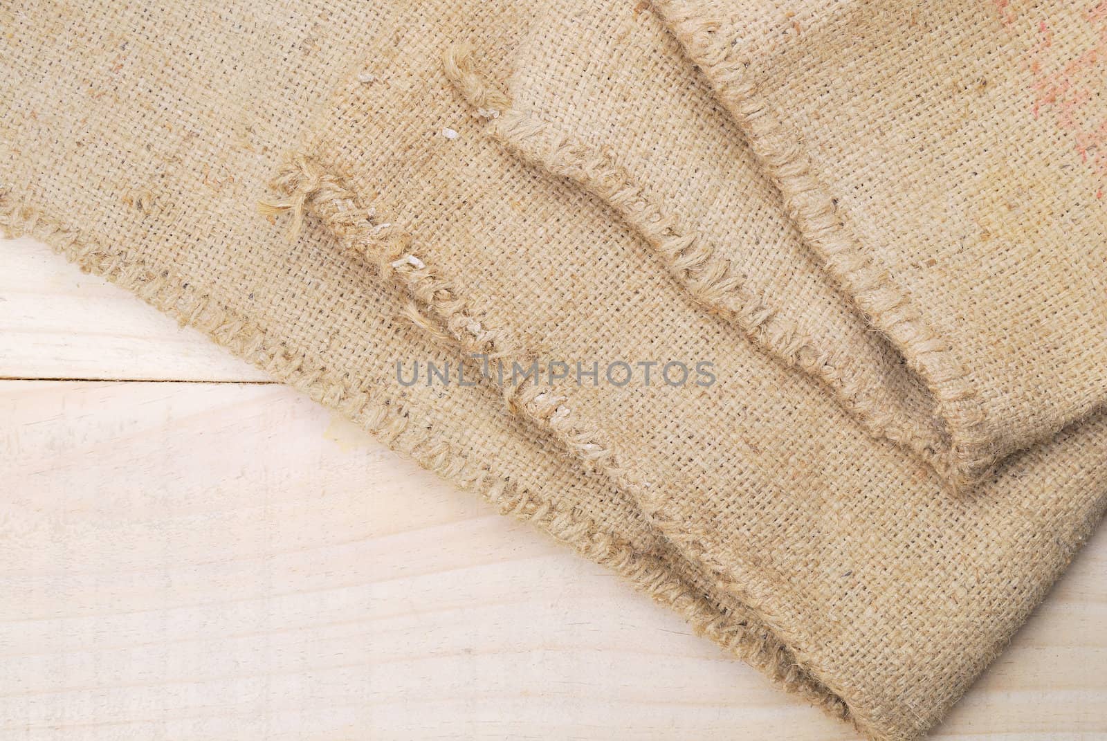 Gunny sack texture and wood plank table background by teen00000