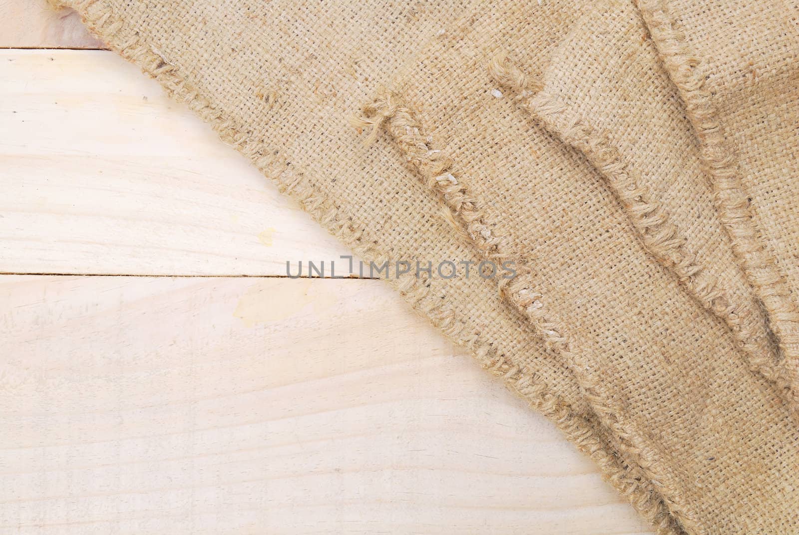 Gunny sack texture and wood plank table background