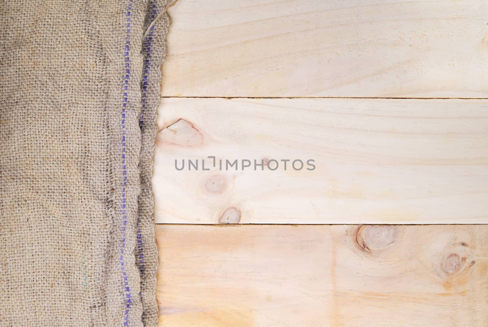 Gunny sack texture and wood plank table background