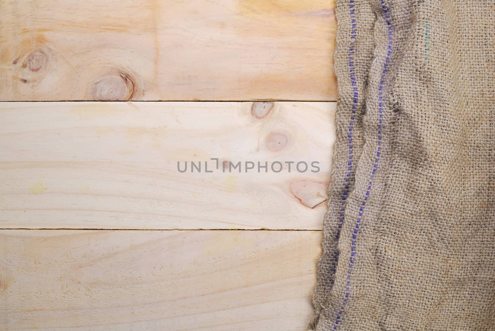 Gunny sack texture and wood plank table background