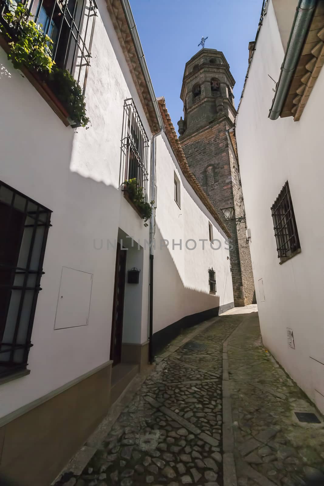 Very narrow street typical of Baeza, the fund for the cathedral in Baeza Jaen province, Andalucia, Spain