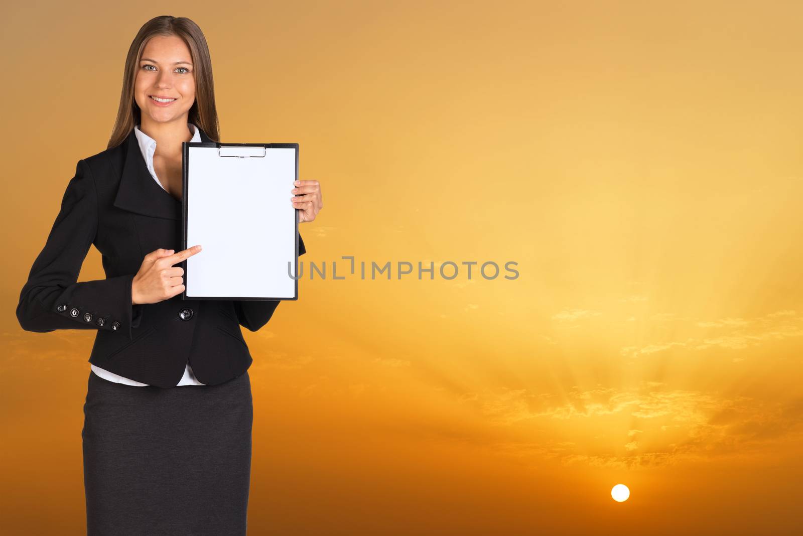 Businesswoman holding paper holder. Magic orange sunset as backdrop