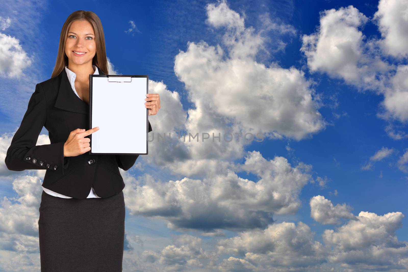 Businesswoman holding paper holder. Blue sky and clouds as backdrop