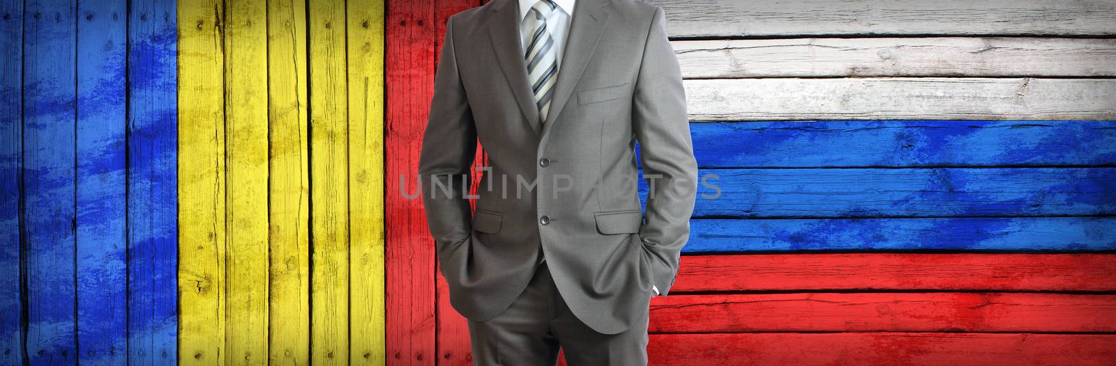 Businessman in a suit. Romania and Russian flags as background. Concept of business