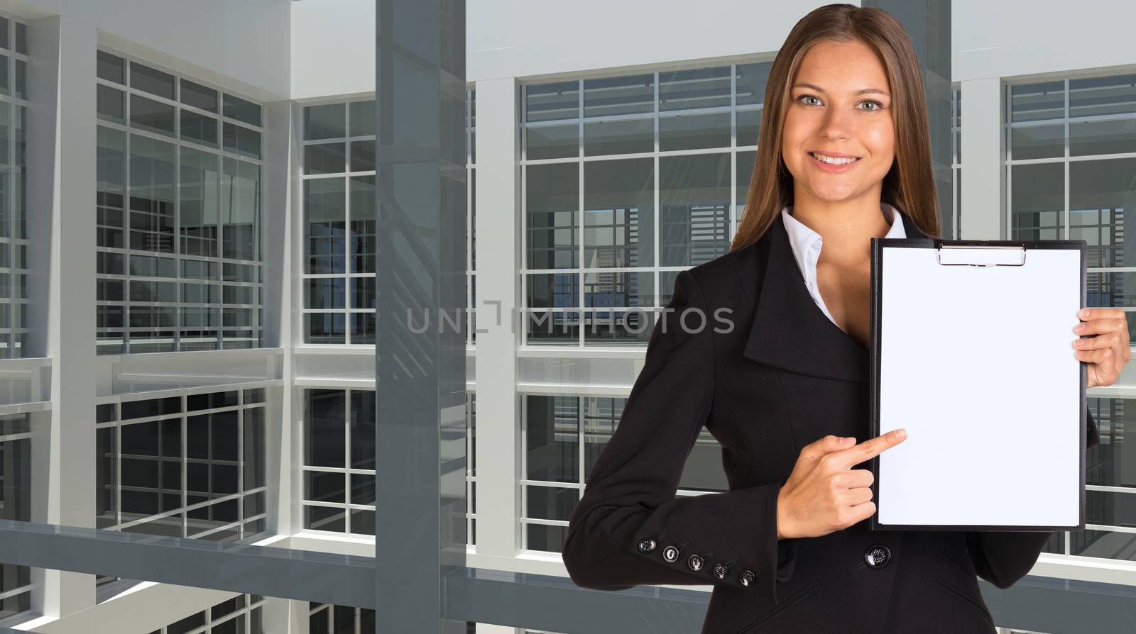 Businesswoman holding paper holder. Large window as backdrop