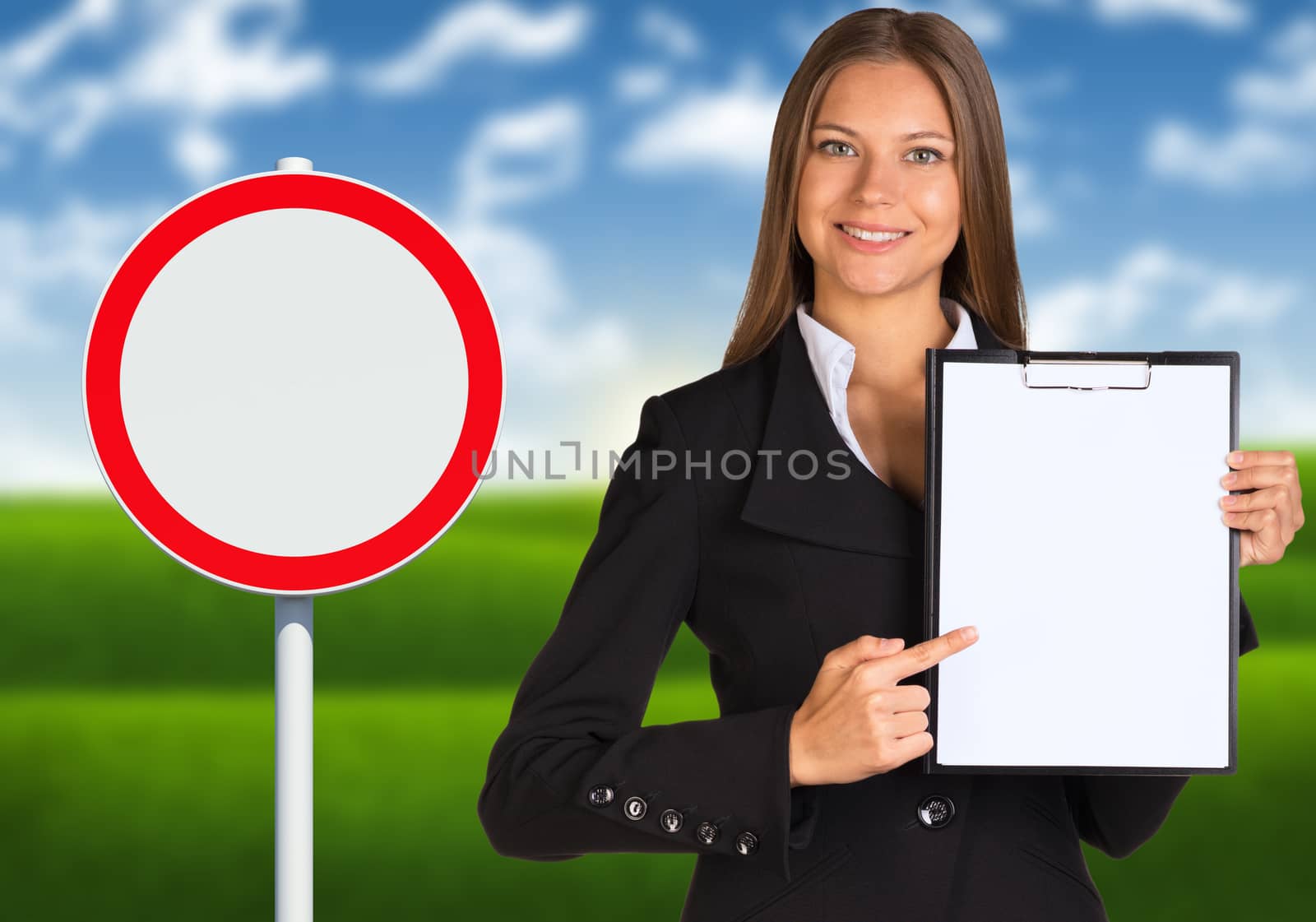 Businesswoman holding paper holder. Road sign with landscape as backdrop