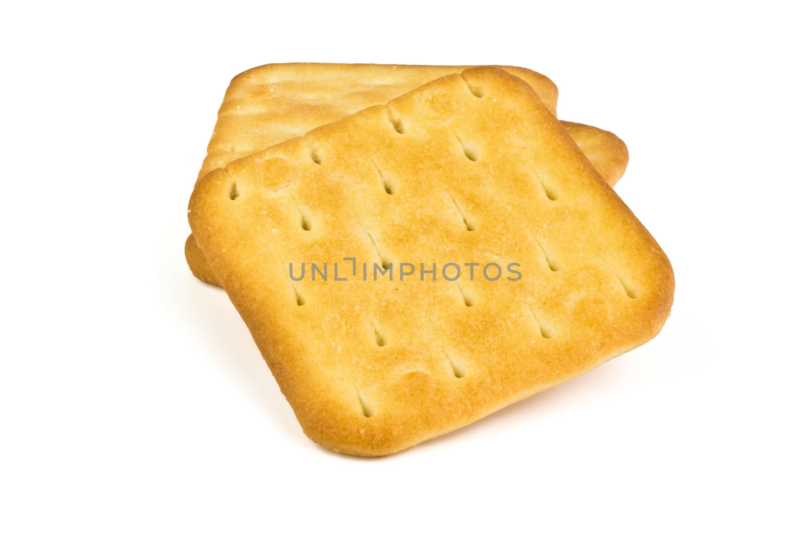 Three square plate of salty crackers isolated on white background