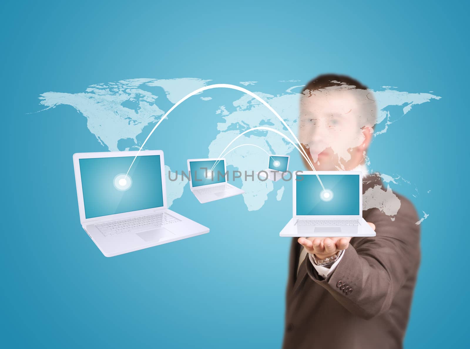 Businessman in a suit hold virtual world map with laptops. Internet concept