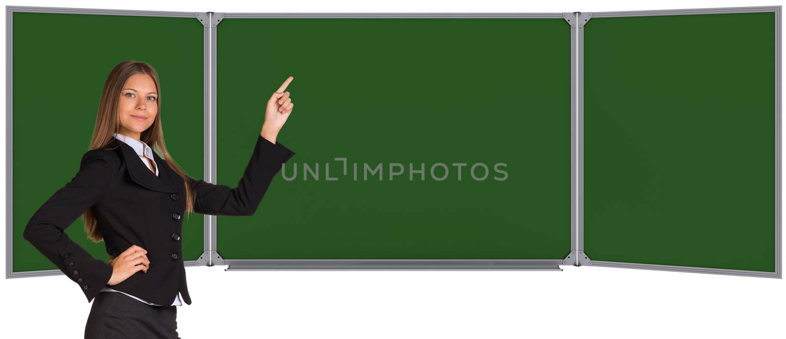 Businesswoman pointing her finger on chalkboard by cherezoff