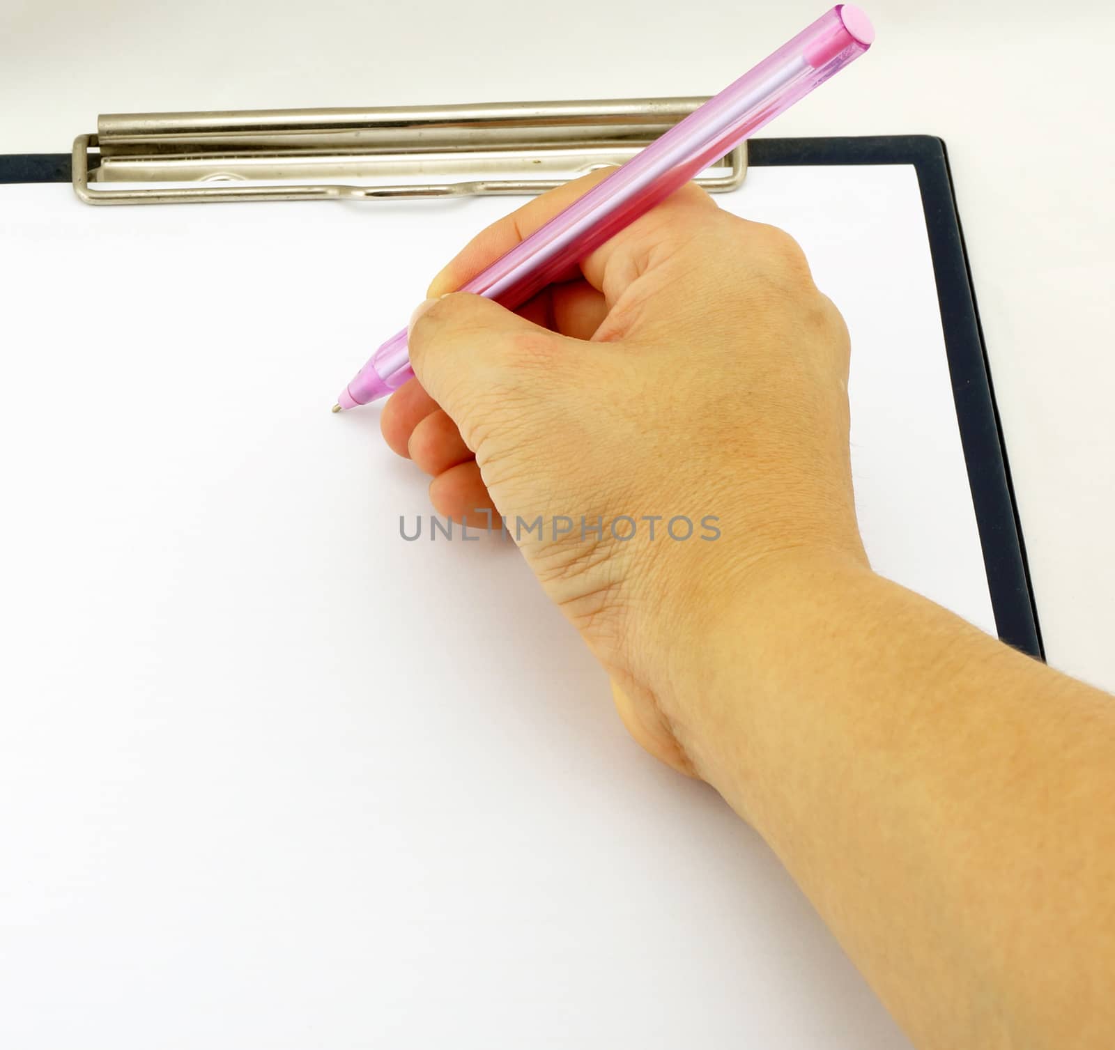 Women are writing notes on a white paper, placed on the board.                               