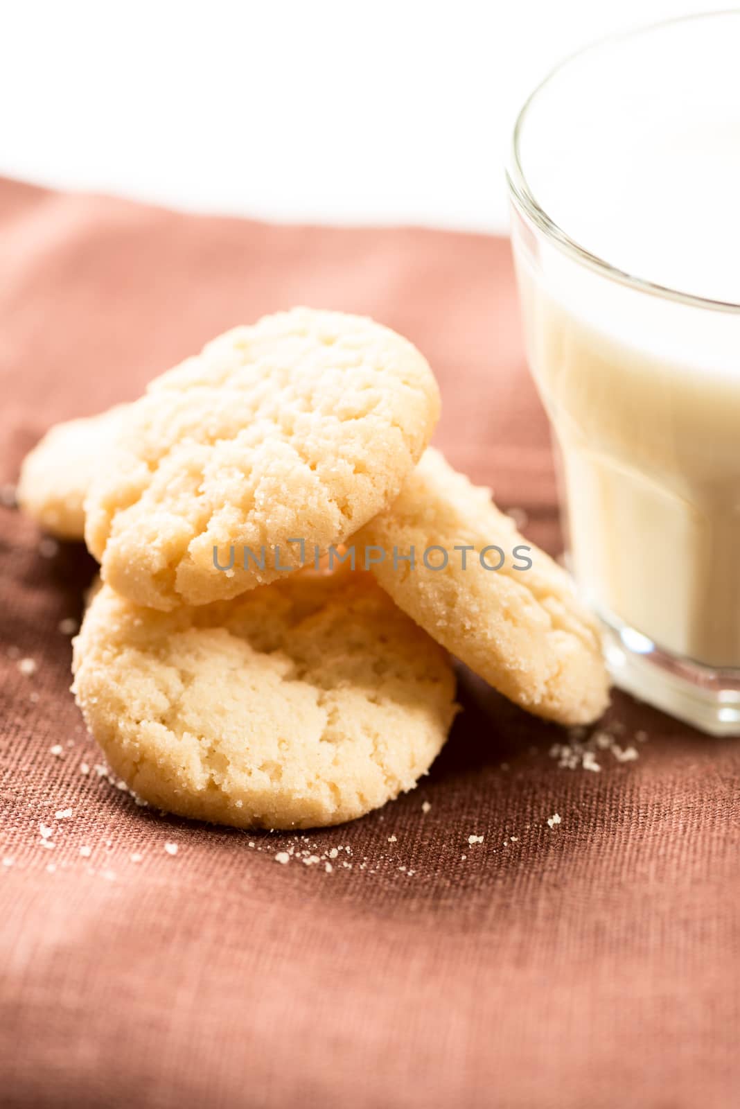 Artistic set: cookies and milk on napkin