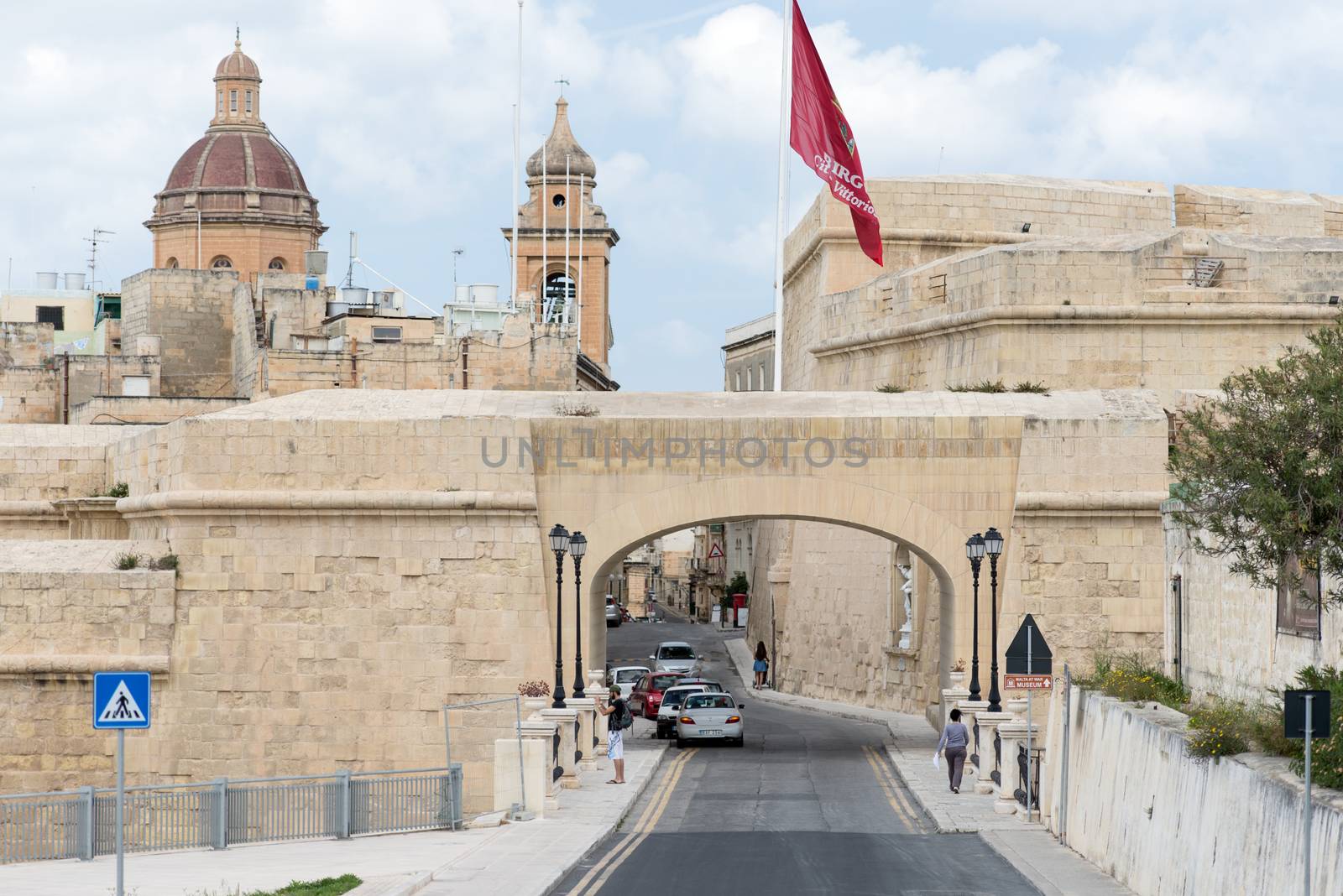 Valletta, Malta - April 12: People and tourists at the streets of Valleta, Malta on April 12, 2014