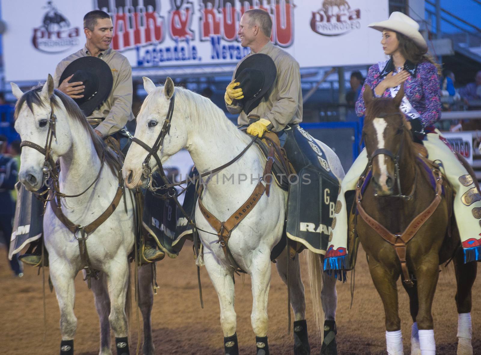 LOGANDALE , NEVADA - APRIL 10 : Cowboys and cowgirl Participates in the opening ceremony of the Clark County Rodeo held in Logandale Nevada , USA on April 10 , 2014 