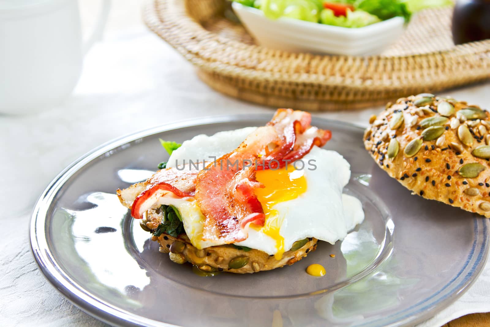 Bacon ,Fried egg and steamed spinach on Pumpkin bread breakfast