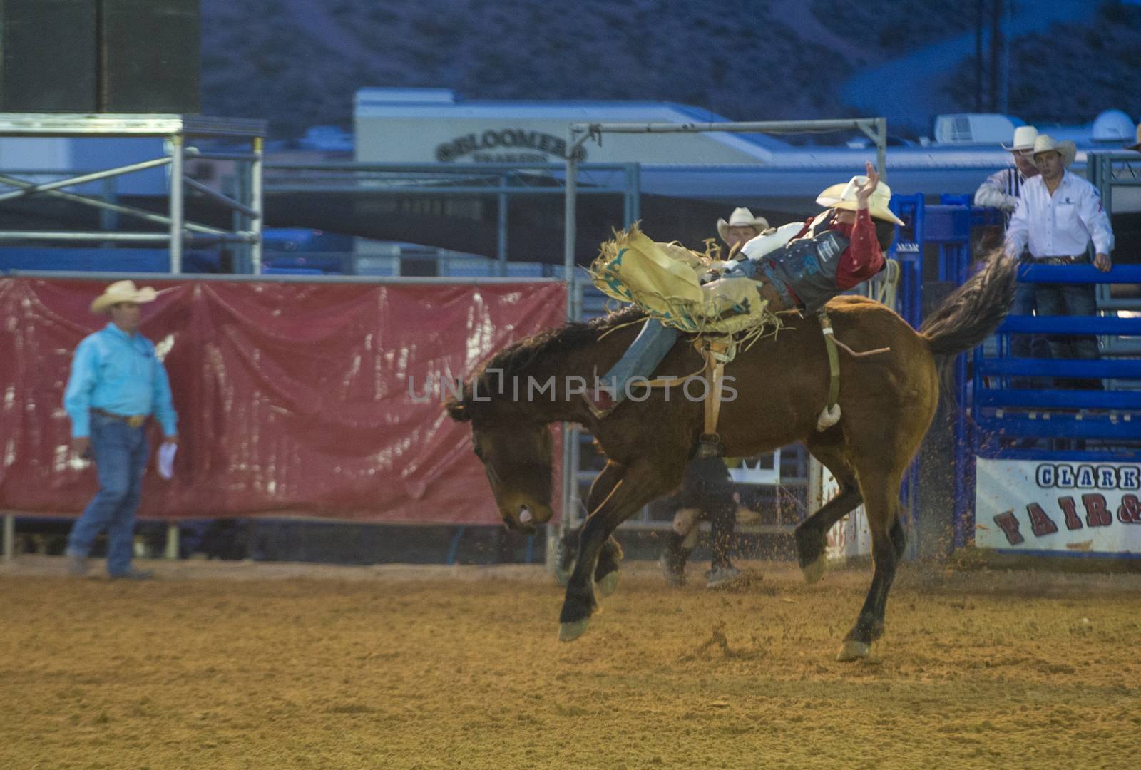 LOGANDALE , NEVADA - APRIL 10 : Cowboy Participating in a Bucking Horse Competition at the Clark County Fair and Rodeo a Professional Rodeo held in Logandale Nevada , USA on April 10 2014 