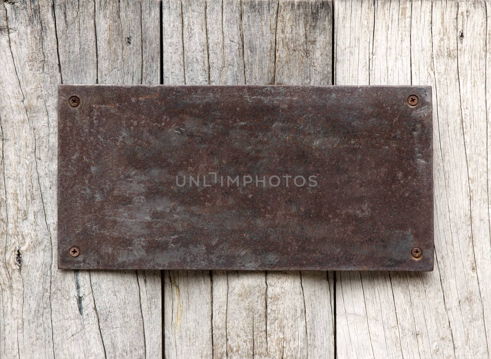 Metal sign on wood plank background