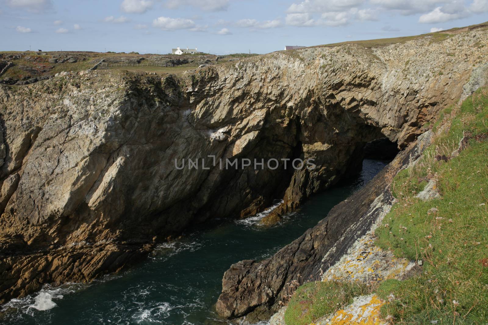 The Bwa Du through cave on the Wales coast path, Rhoscolyn, Anglesey, Wales, UK.