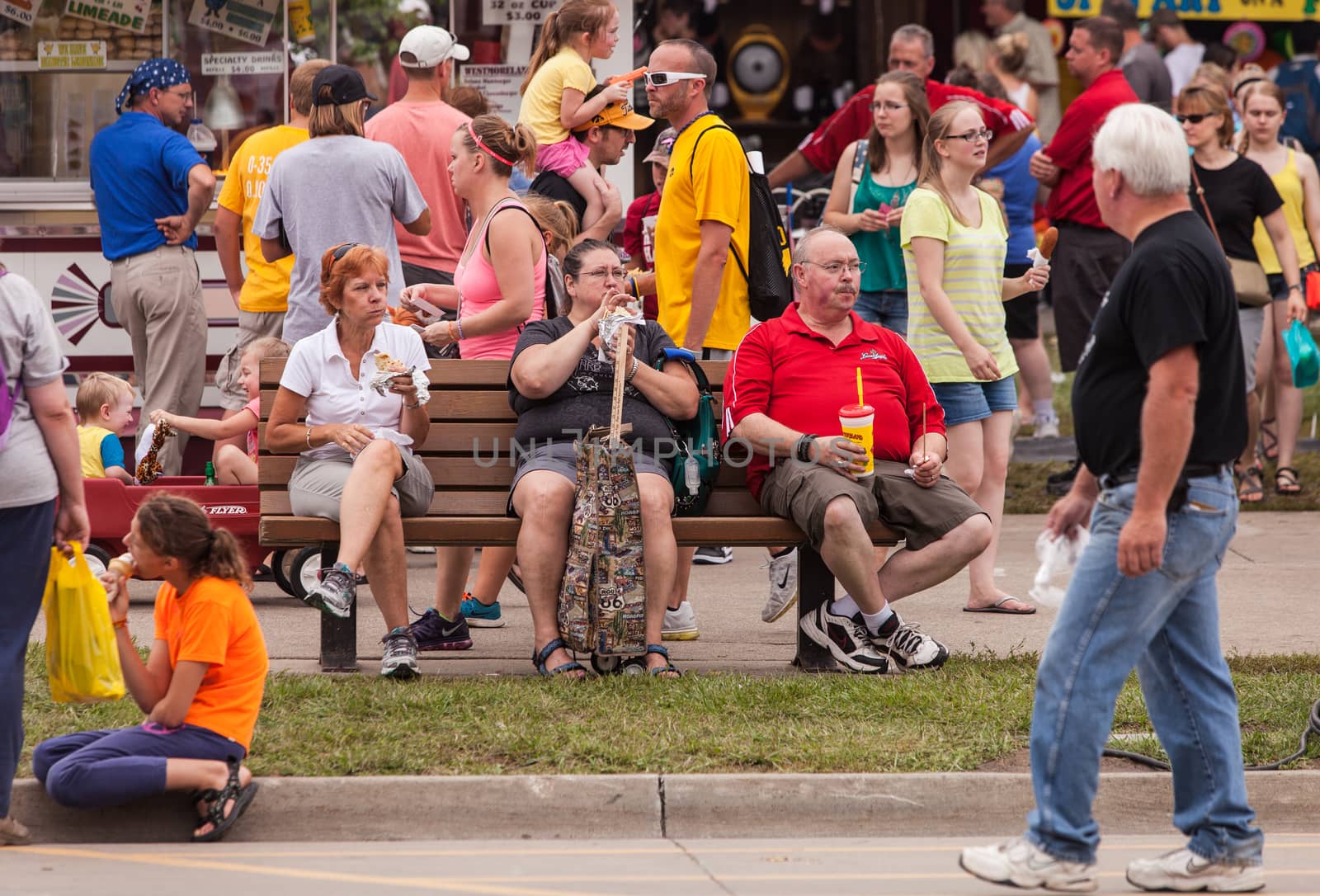 People eating at the Iowa State Fair by Creatista