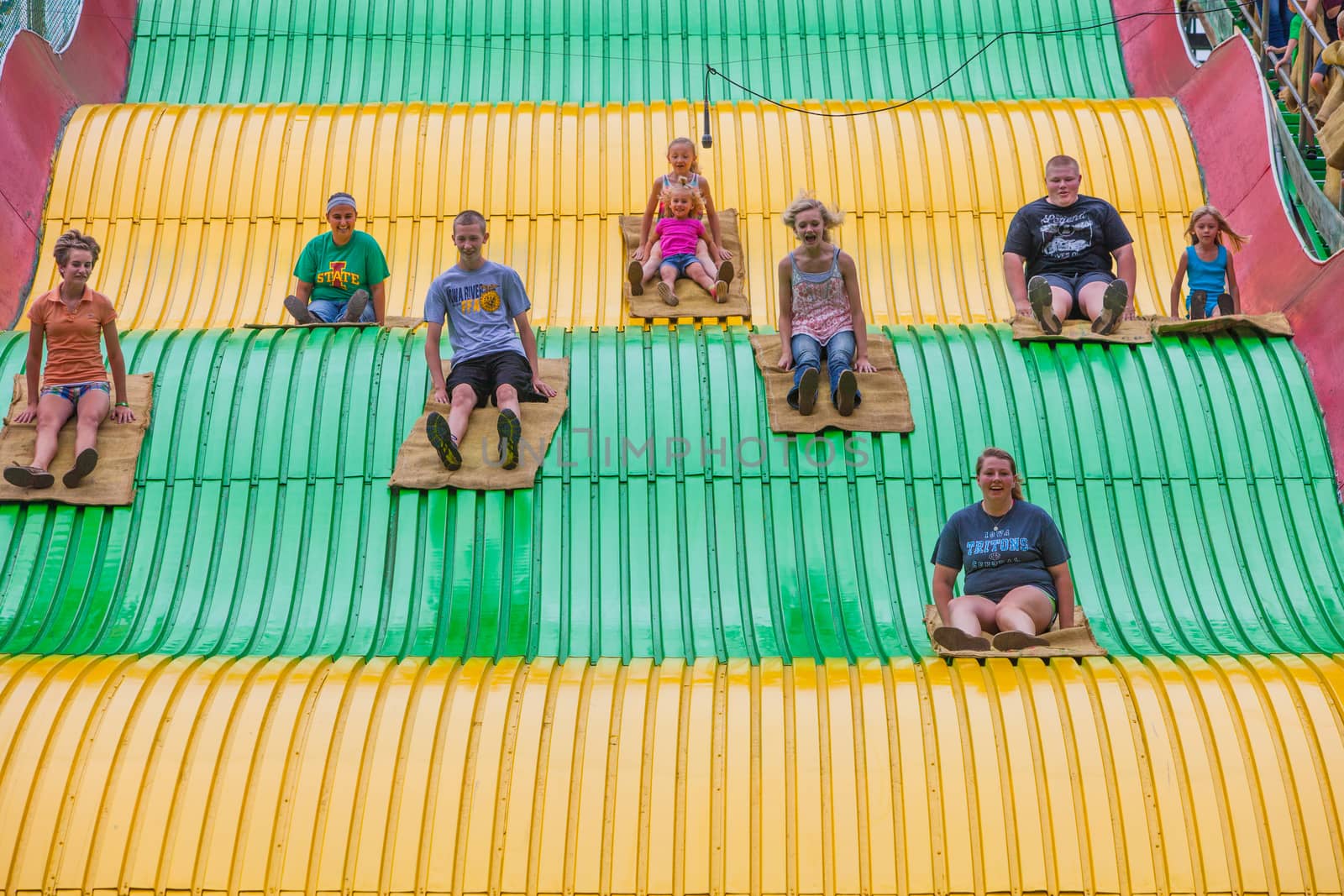 DES MOINES, IA /USA - AUGUST 10: Unidentified children on jumbo slide at the Iowa State Fair on August 10, 2014 in Des Moines, Iowa, USA.