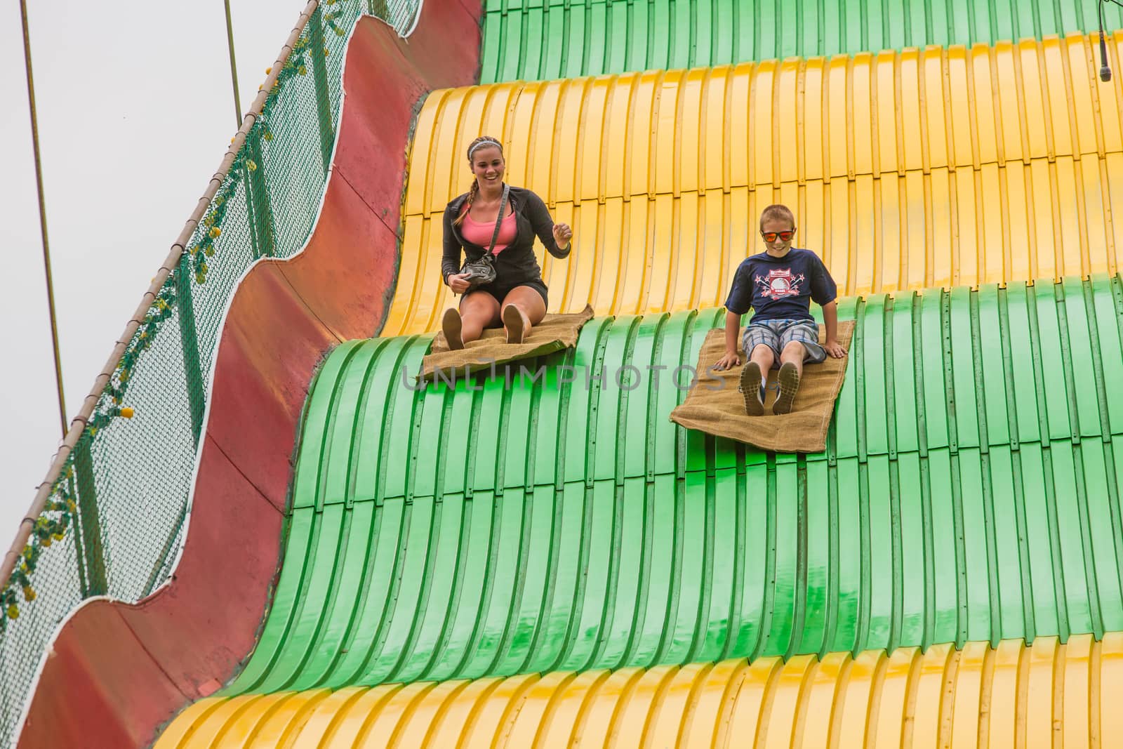 DES MOINES, IA /USA - AUGUST 10: Unidentified children on jumbo slide at the Iowa State Fair on August 10, 2014 in Des Moines, Iowa, USA.