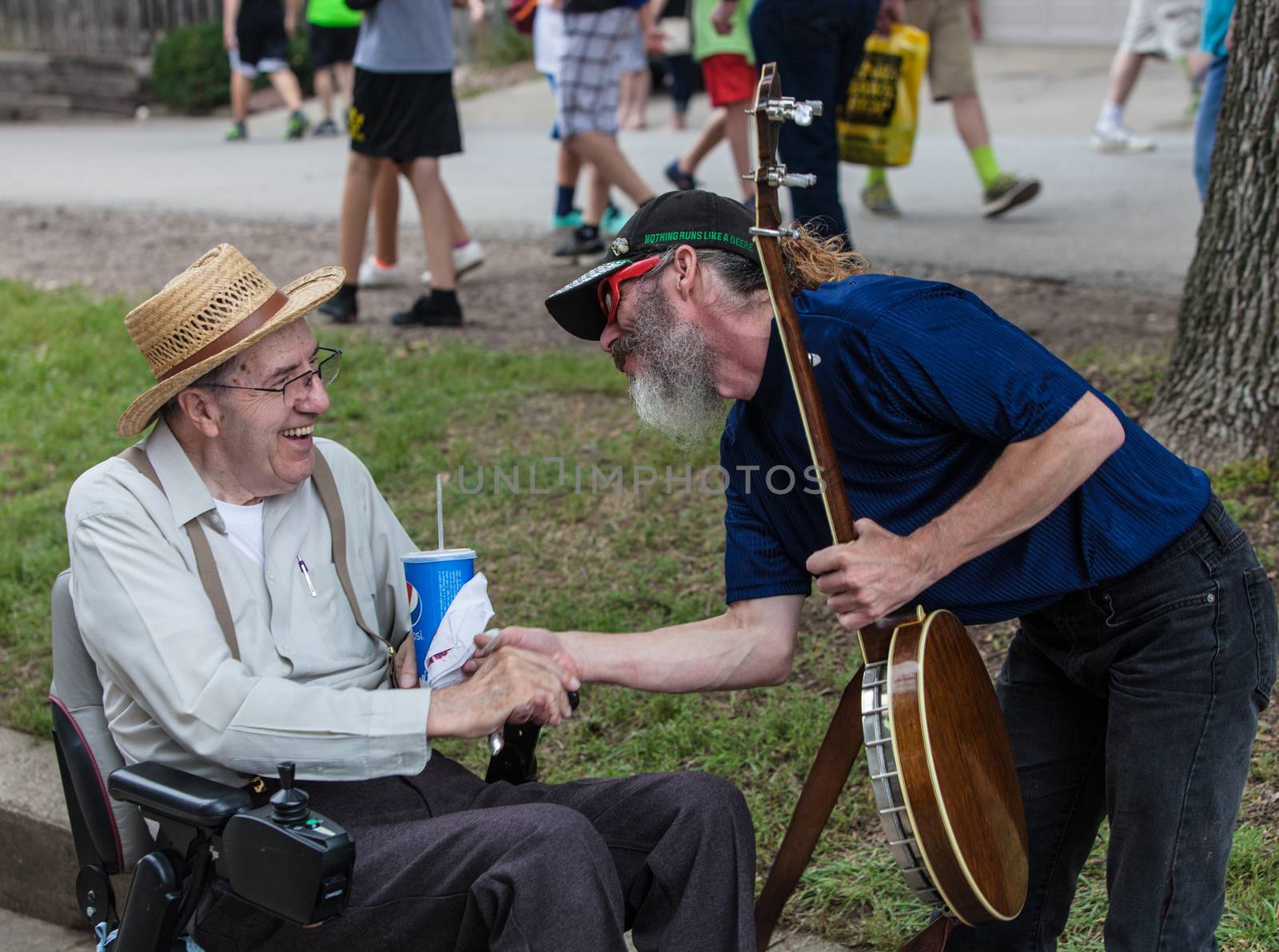 Banjo Player with Man in Wheelchair at Iowa State Fair by Creatista