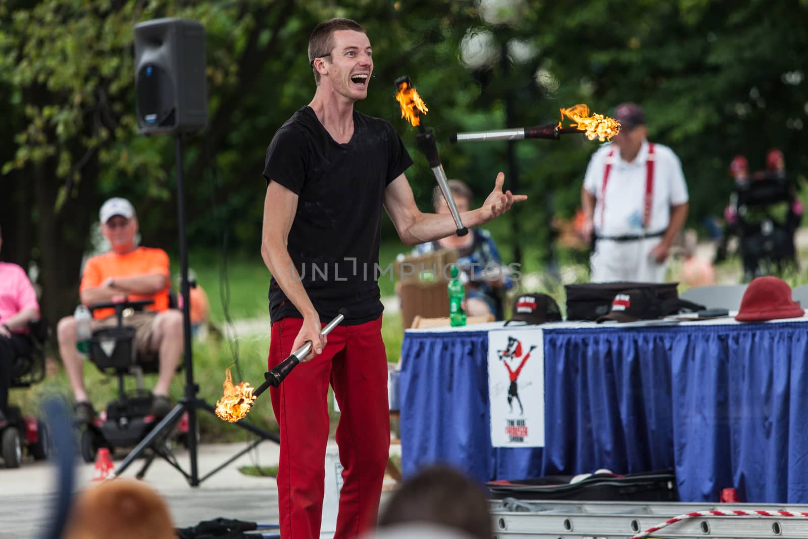 DES MOINES, IA /USA - AUGUST 10: Red Trouser Show juggler Tobin Renwick at the Iowa State Fair on August 10, 2014 in Des Moines, Iowa, USA.