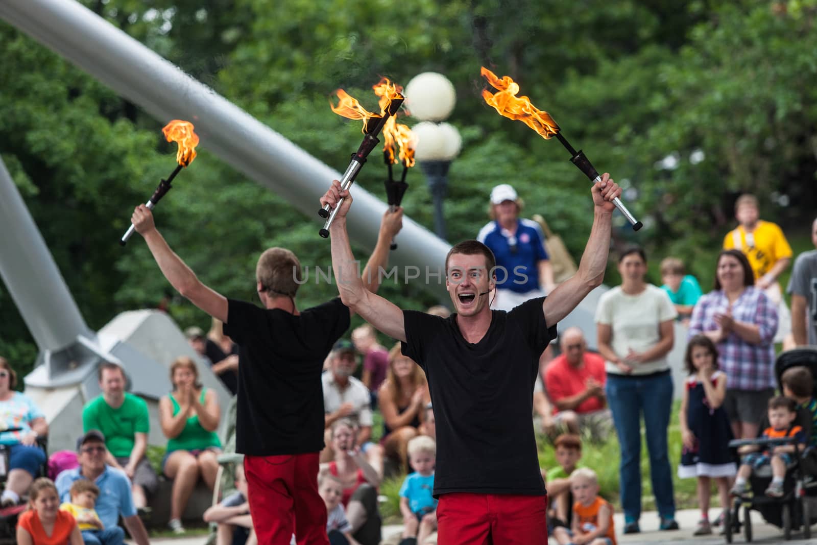 DES MOINES, IA /USA - AUGUST 10: Red Trouser Show jugglers Tobin Renwick facing ahead and David Graham at the Iowa State Fair on August 10, 2014 in Des Moines, Iowa, USA.