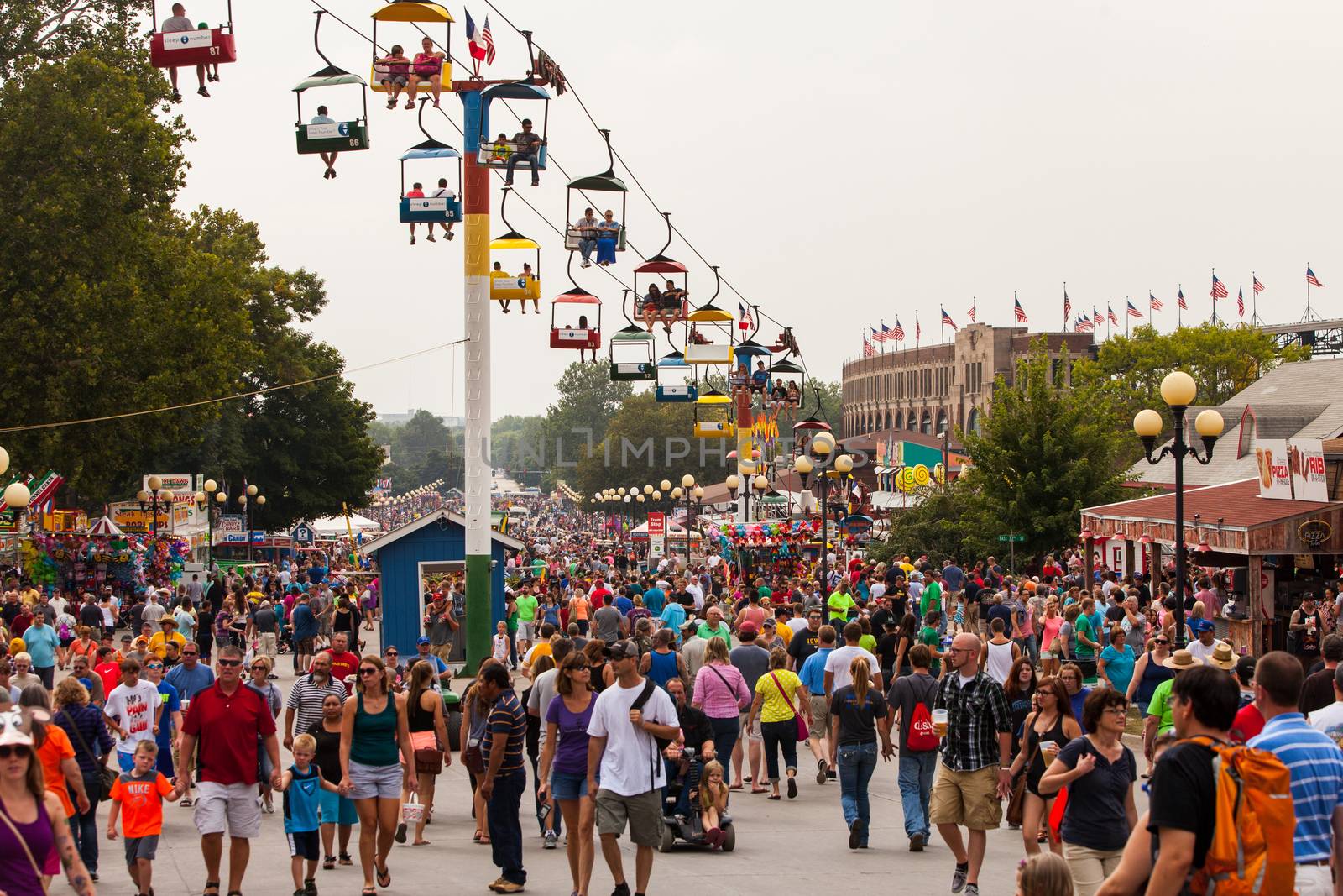 DES MOINES, IA /USA - AUGUST 10: Attendees at the Iowa State Fair. Thousands of people filling the midway at the Iowa State Fair on August 10, 2014 in Des Moines, Iowa, USA.