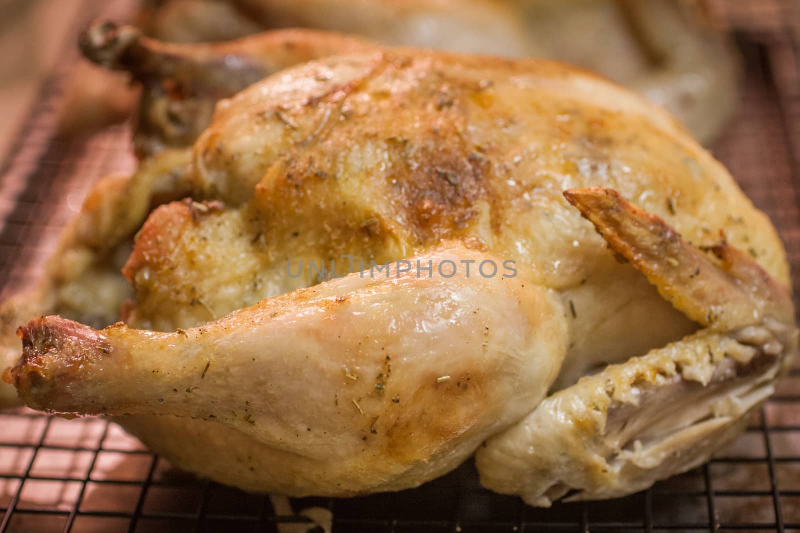 Roast Chicken on a cooling rack. by SouthernLightStudios