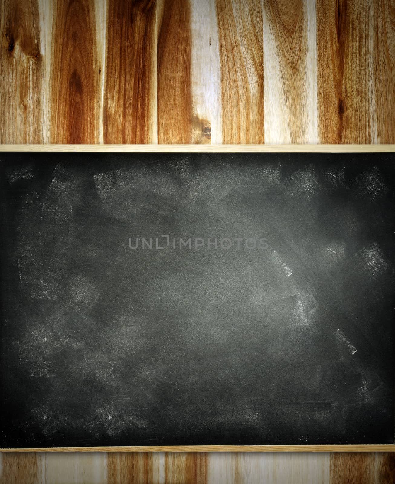 Blank blackboard on wooden wall