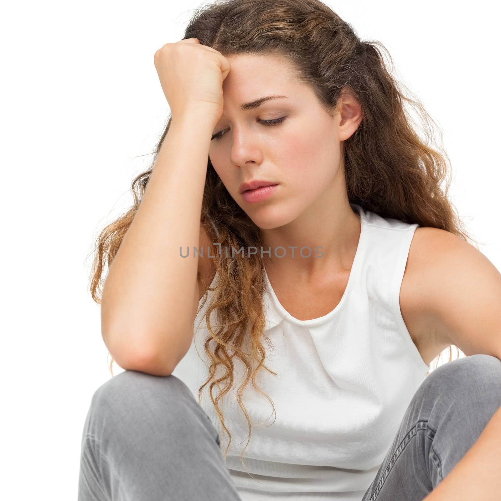 Close-up of a sad young woman over white background
