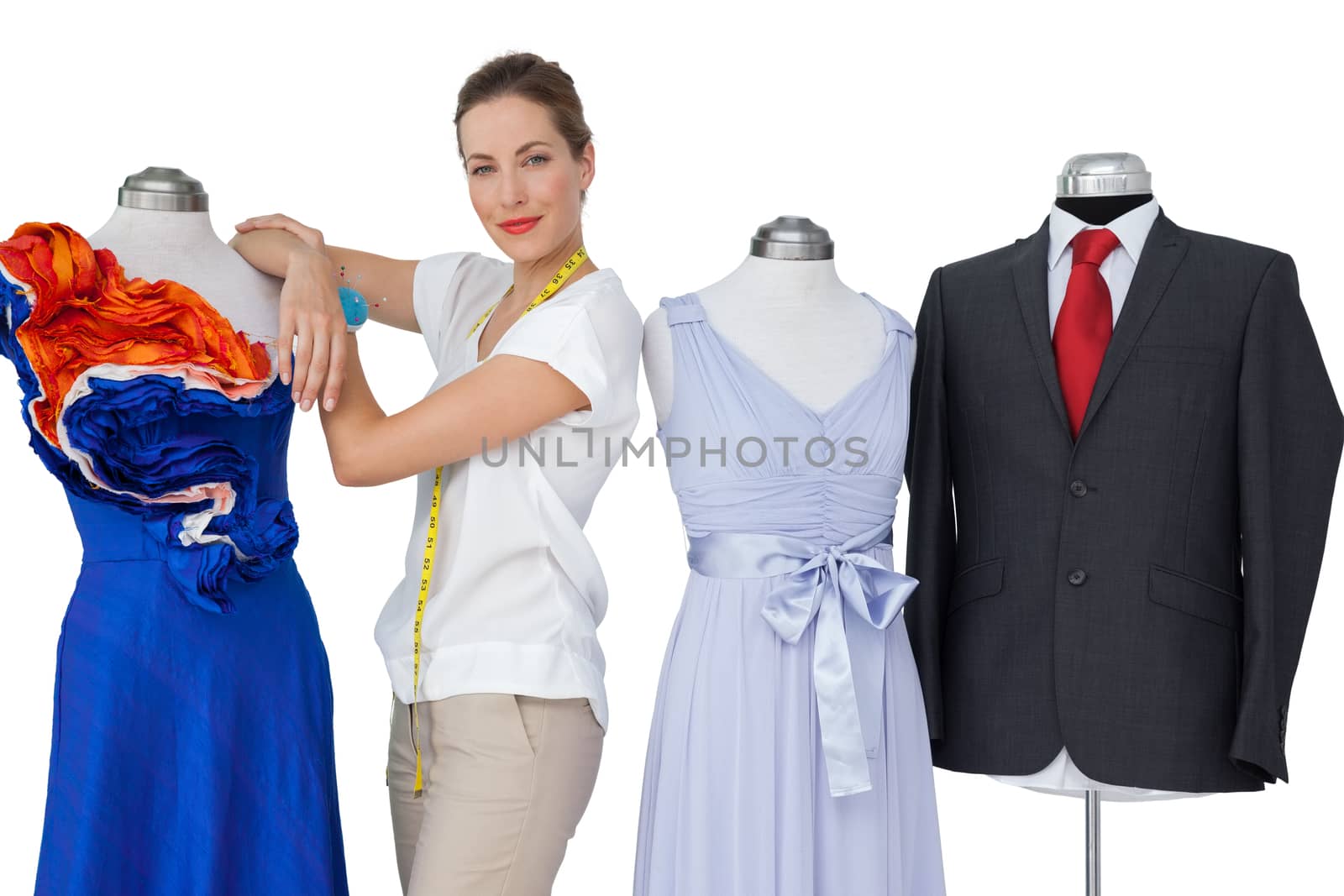 Portrait of a female fashion designer and mannequins isolated on white background